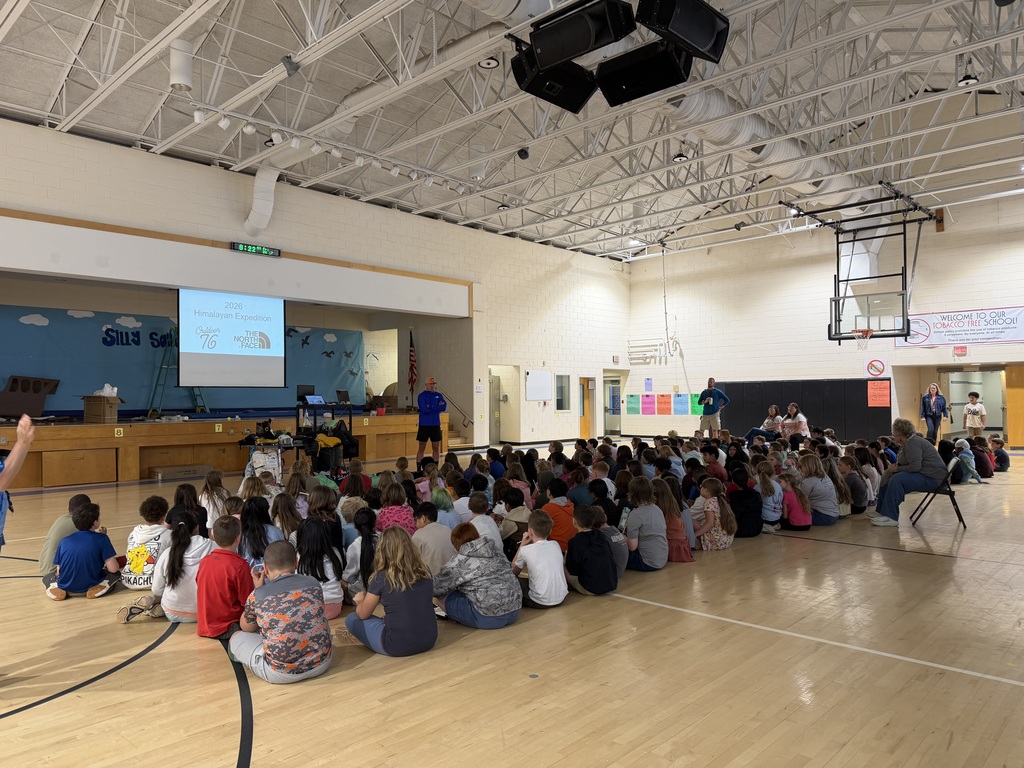 Image of 3rd and 4th grade students watching presentation.