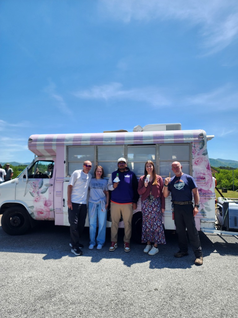 Teachers with ice cream in front of ice cream truck