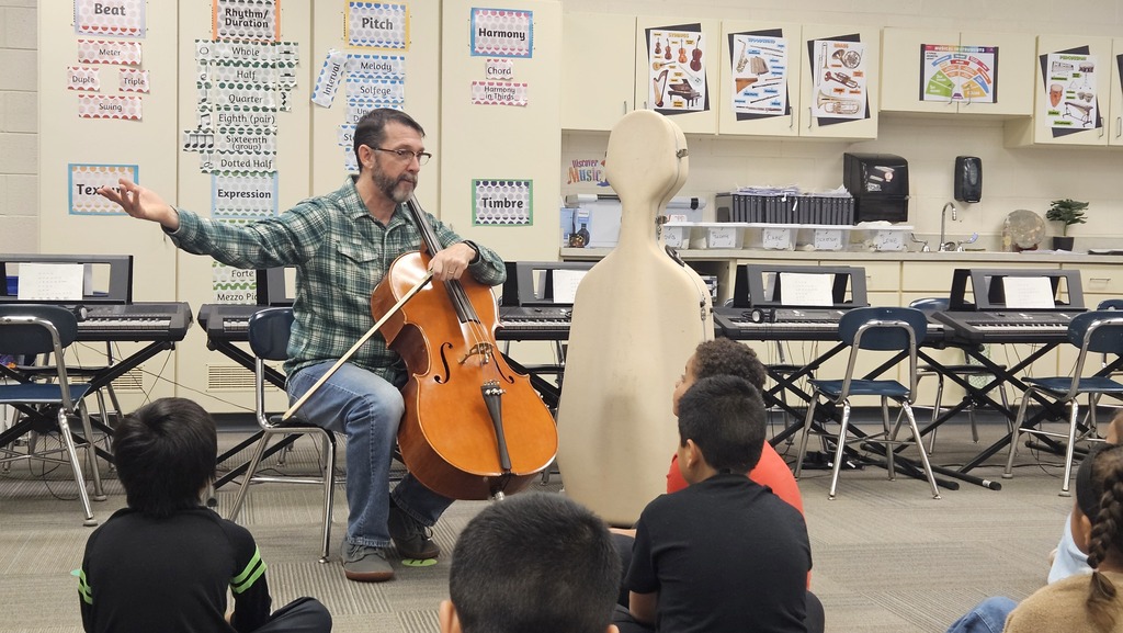 Mr. Pope playing cello for 3rd grade.