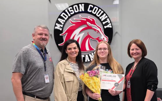 Picture of MCMS Principal Brian Turner, Curriculum Director Meghann Farmer, Assistant Superintendent Amanda Sailors, and MCMS Student Aubri Wallace, who was named a Young Georgia Authors Honorable Mention at the state level.