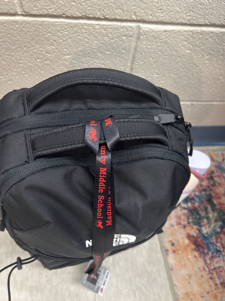 Idea for how to keep student ID badges connected to bookbags while at home.