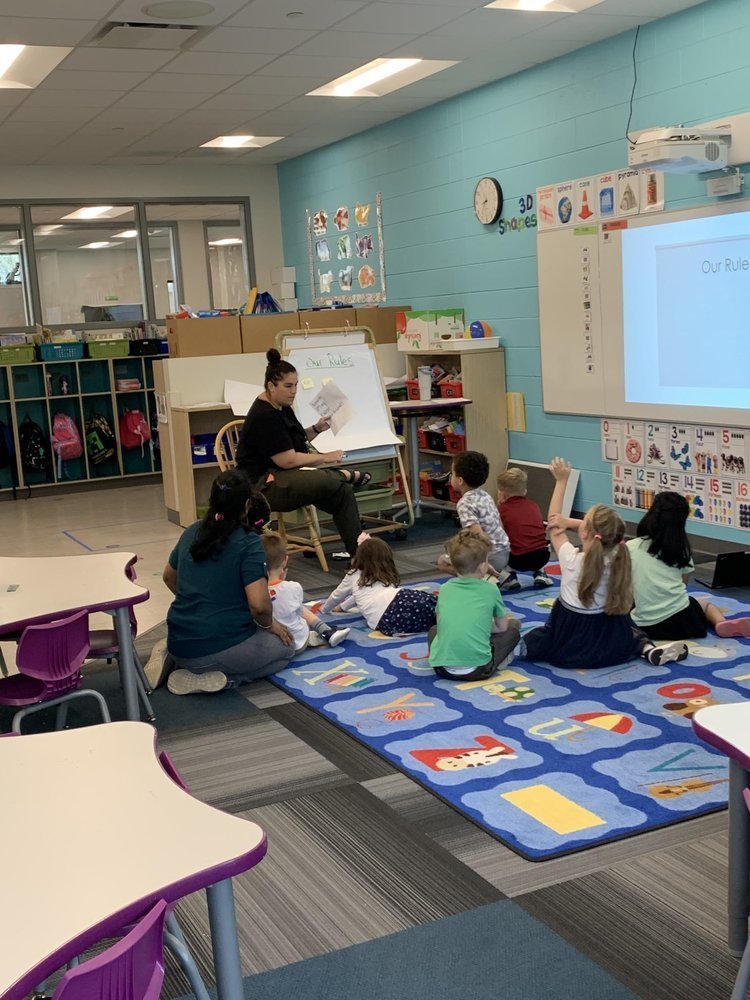 Teacher teaching students at Kindergarten Leap