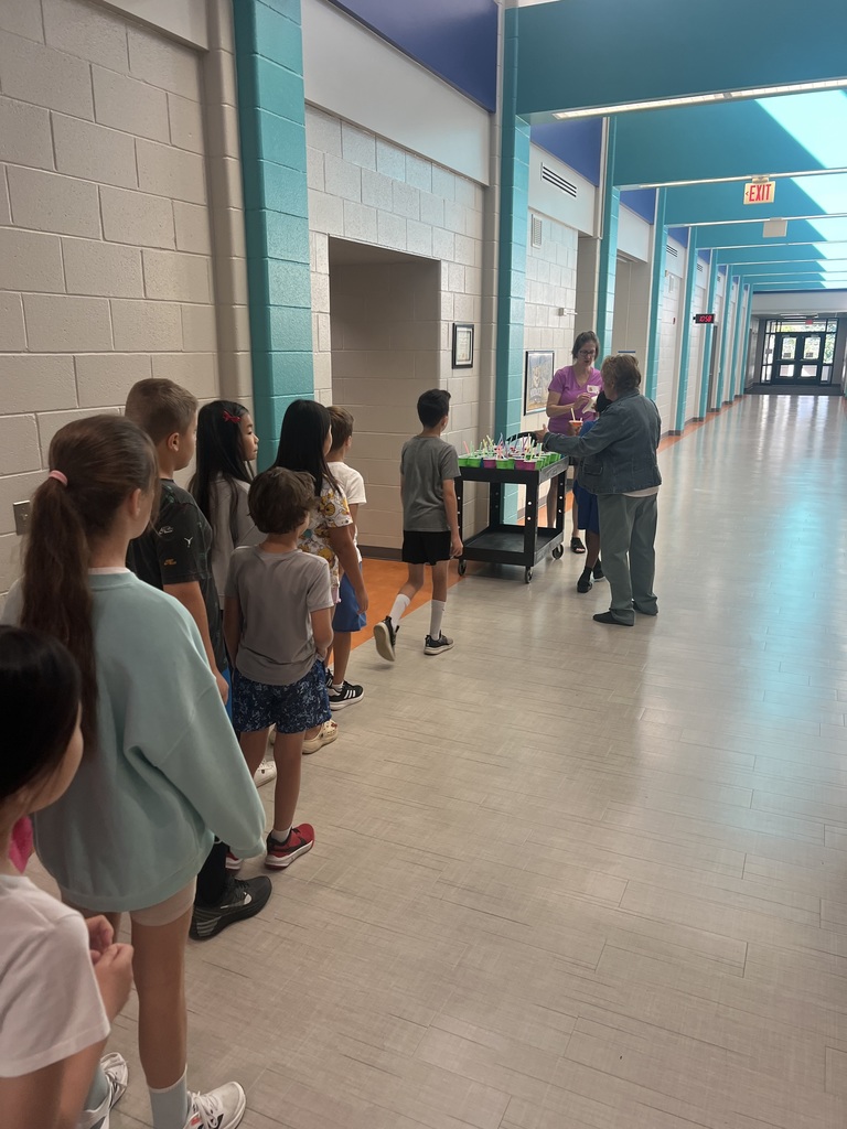 Students standing in line to get milkshakes