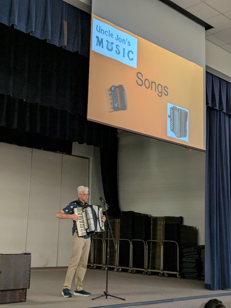 Uncle Jon performs with his accordion on stage