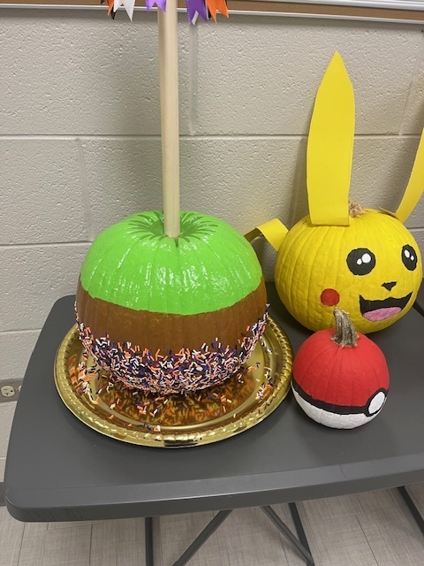 A pumpkin decorated to look like a caramel apple