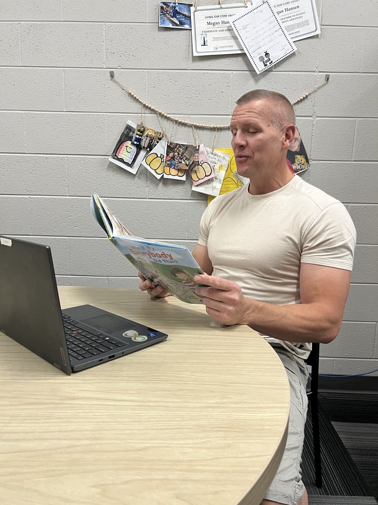 Teacher holding a book 