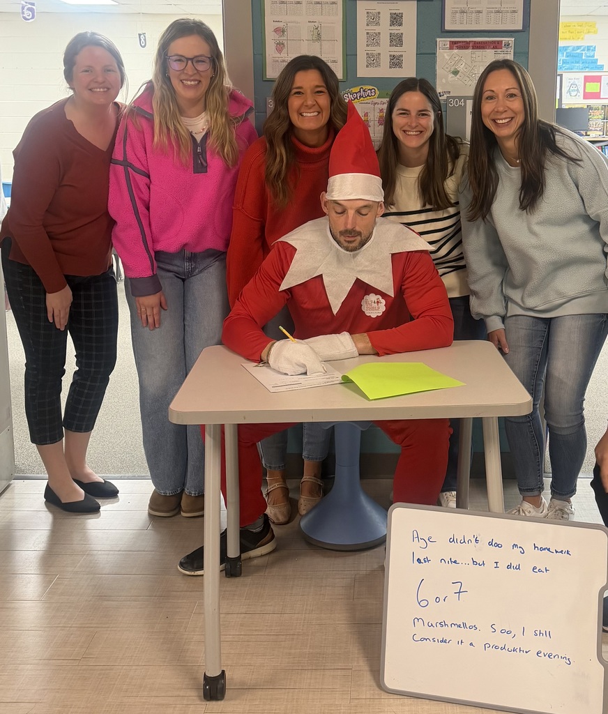 Staff posing with elf on the shelf