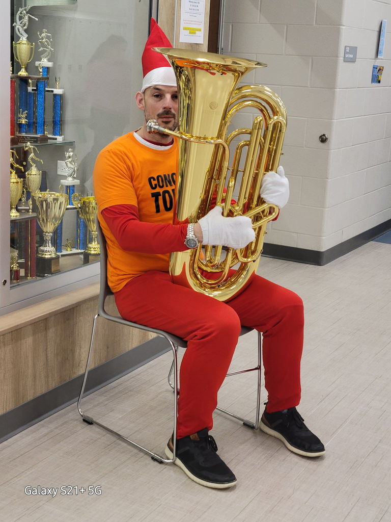 Elf on the shelf with a tuba