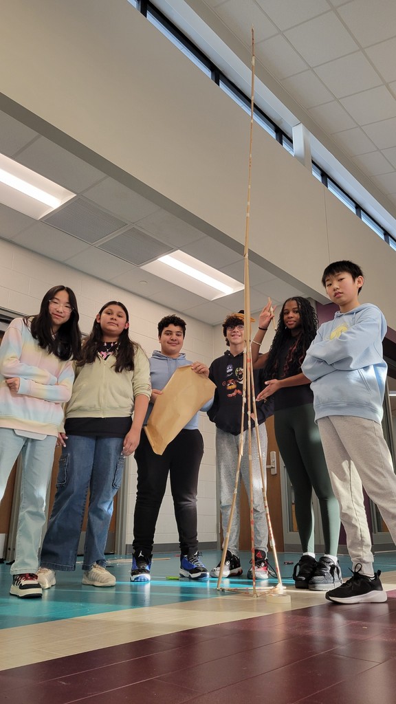 The first place team poses with their tower