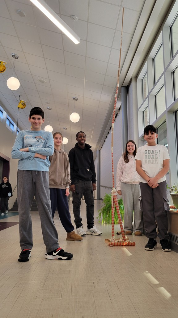 The second place team poses with their tower