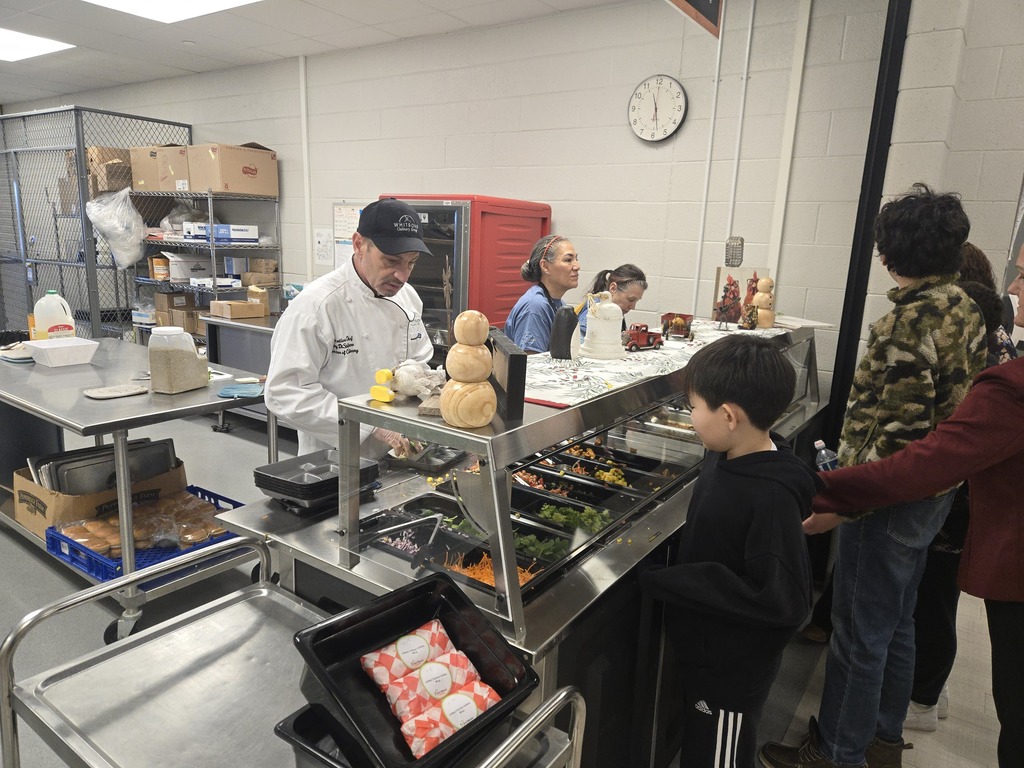 Chef Tony prepares food for students