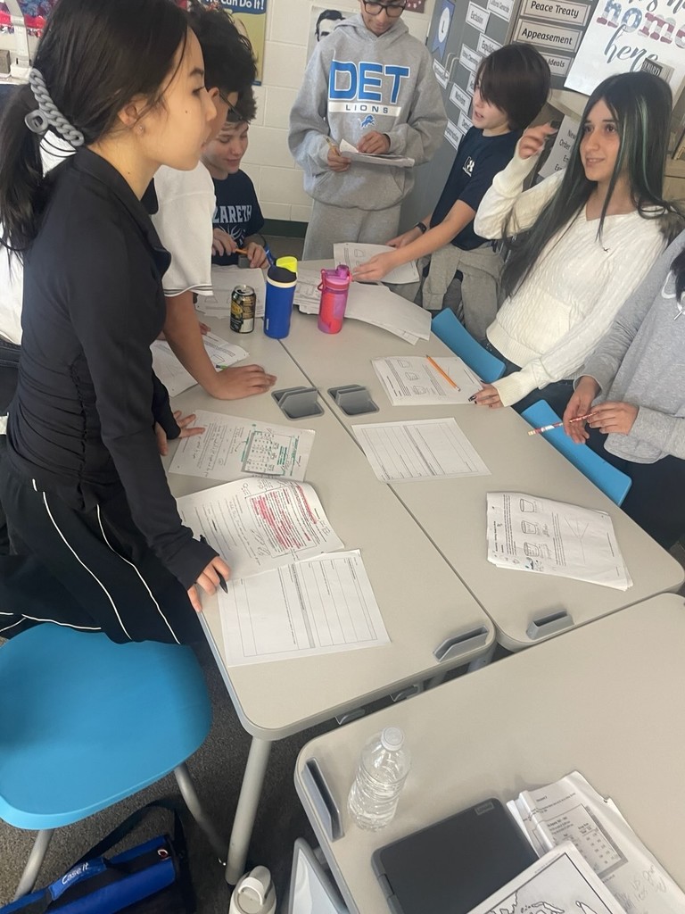 Kids conduct research and discuss with each other in class