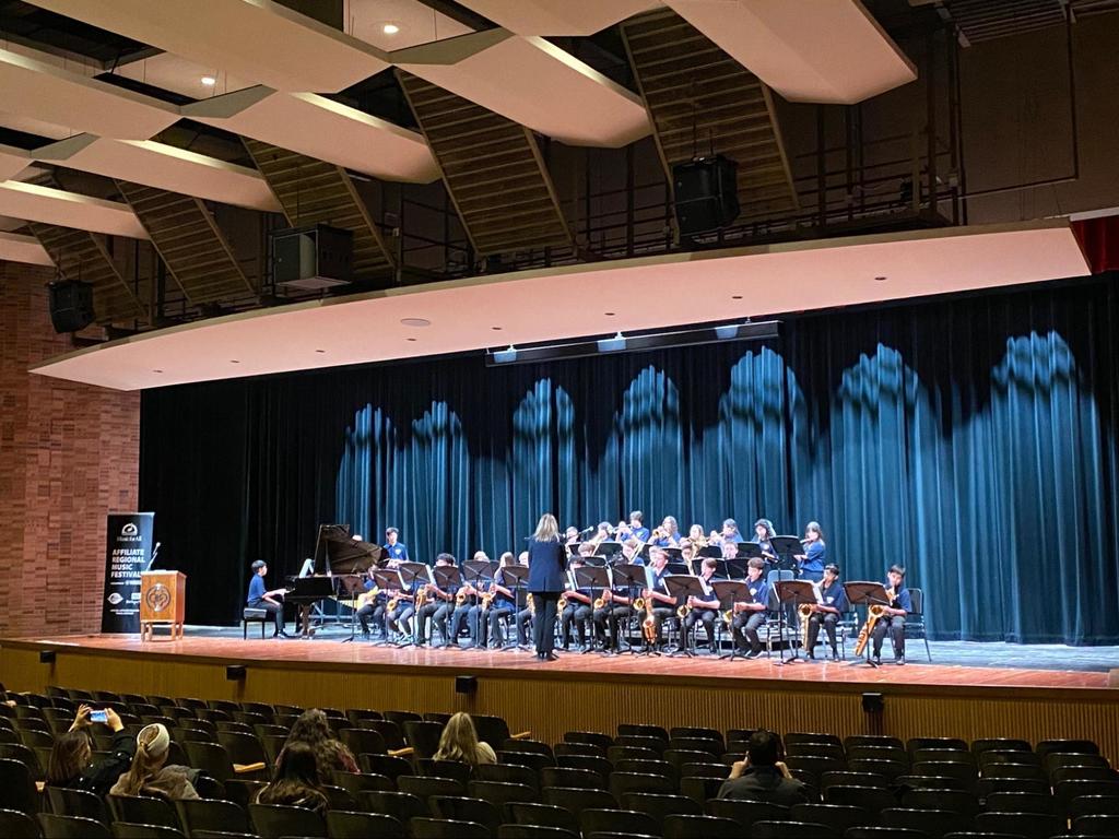 The band plays on stage