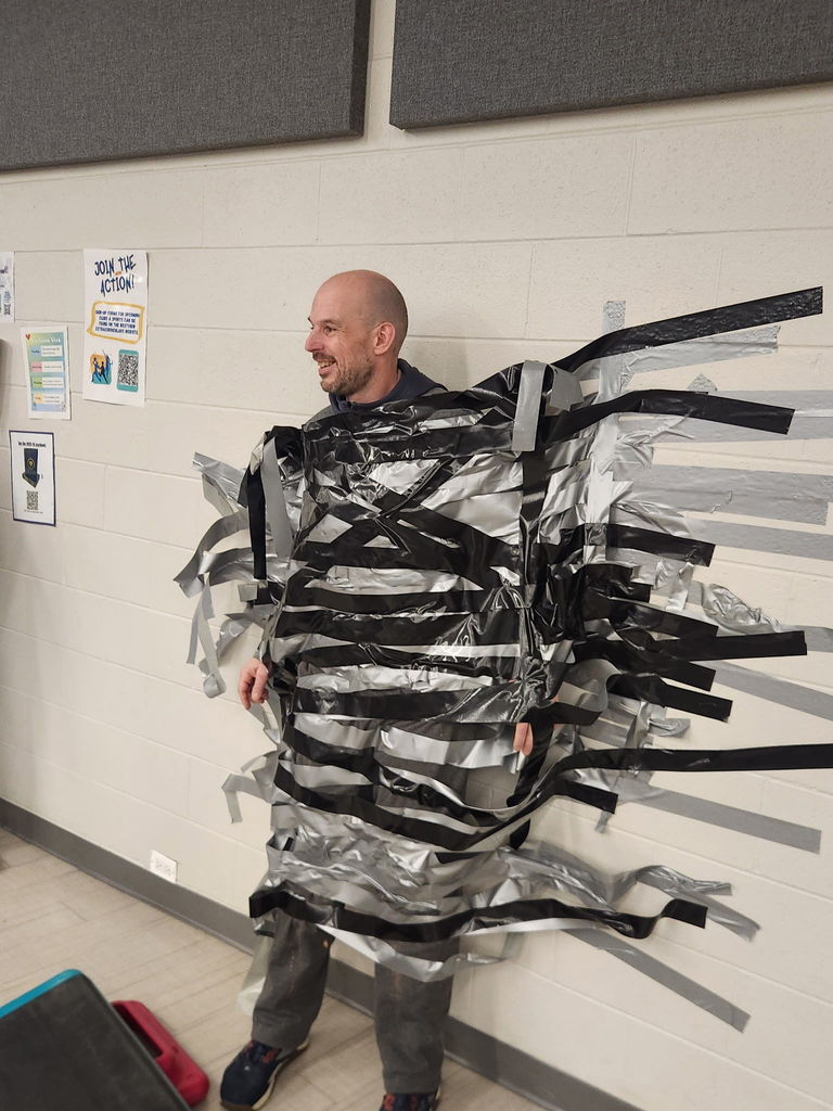 Principal duct taped to the wall