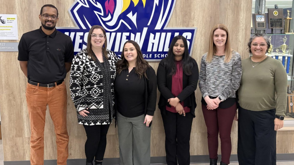 Members of the board pose with Gold Standard staff members