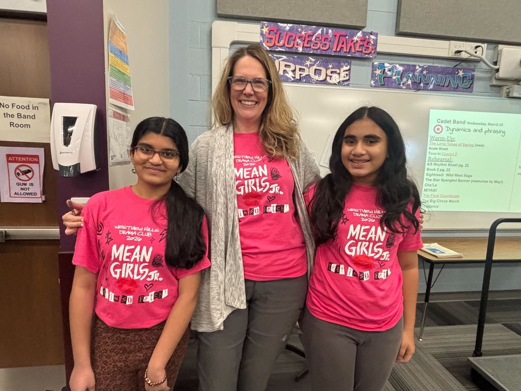 Students and teacher wearing pink mean girls jr shirts