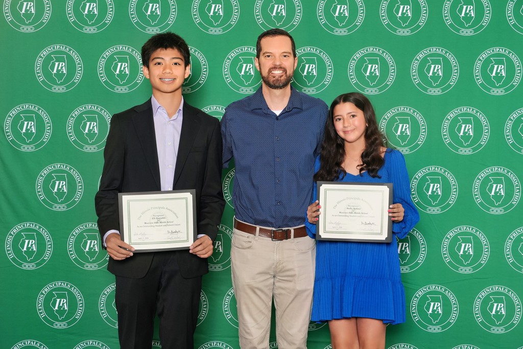 8th graders Stella A. and Eli I. pose with their certificates
