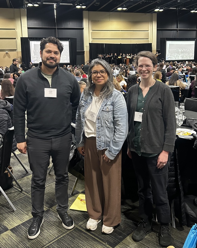 Teacher Cesar Tamayo, Multilingual Specialist Estela Rosales-Harrigan, and parent Jeanie Abbott pose together at the 20th Annual Statewide Summit for Bilingual Parents