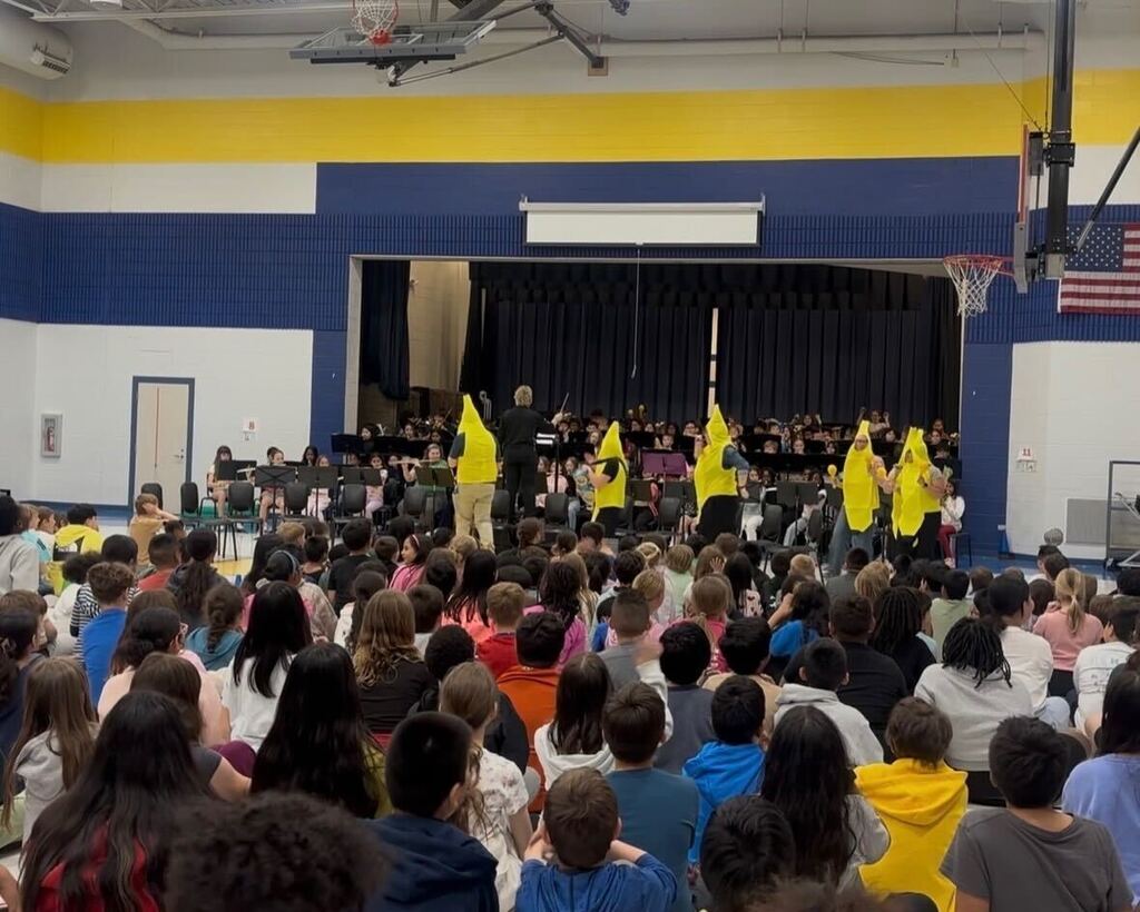 The band performs while teachers dressed in banana costumes dance