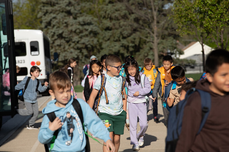 Holmes students walk into school from the buses