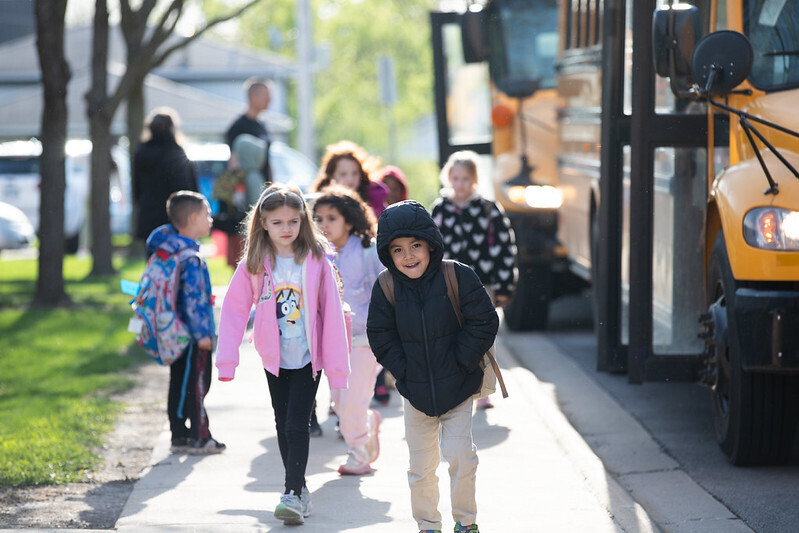 Holmes students walk into school from the buses