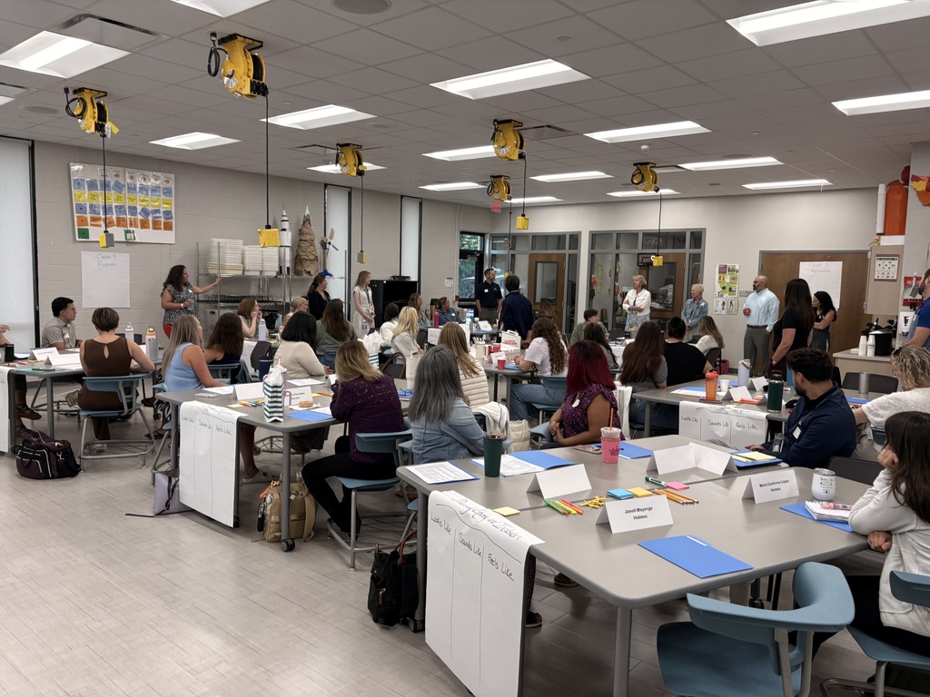 Staff are gathered together during the new staff orientation