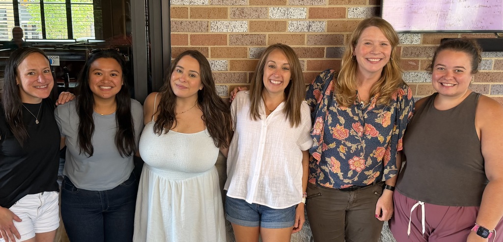 The 5th grade team poses and smiles together