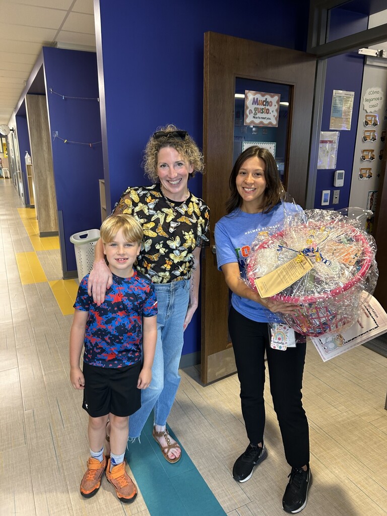 BPAC President Casey Rheaume and her son Charlie delivering gifts to staff