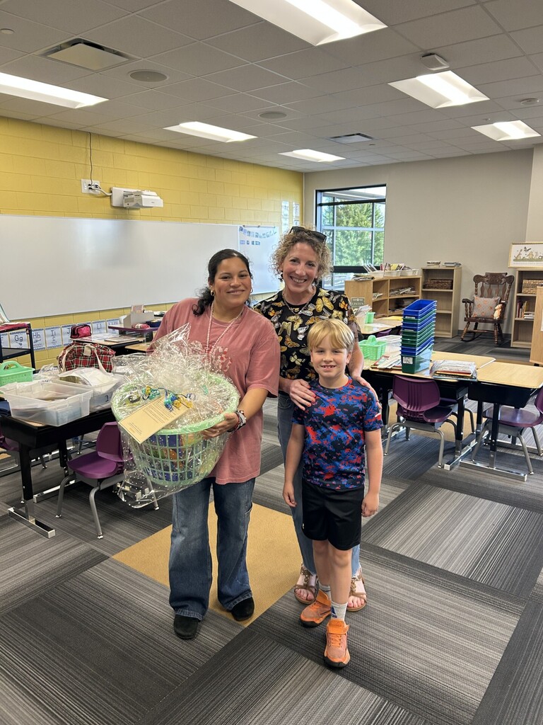 BPAC President Casey Rheaume and her son Charlie delivering gifts to staff