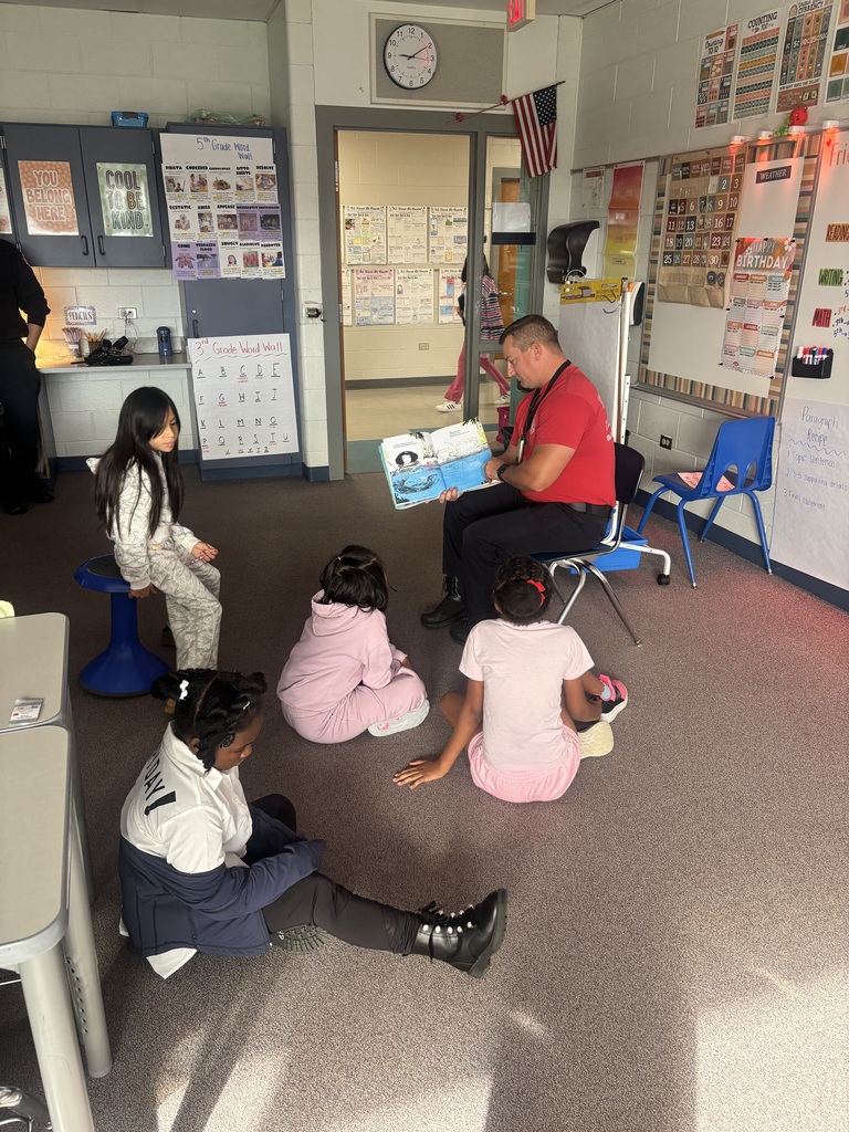 Fire fighters reading to stduents