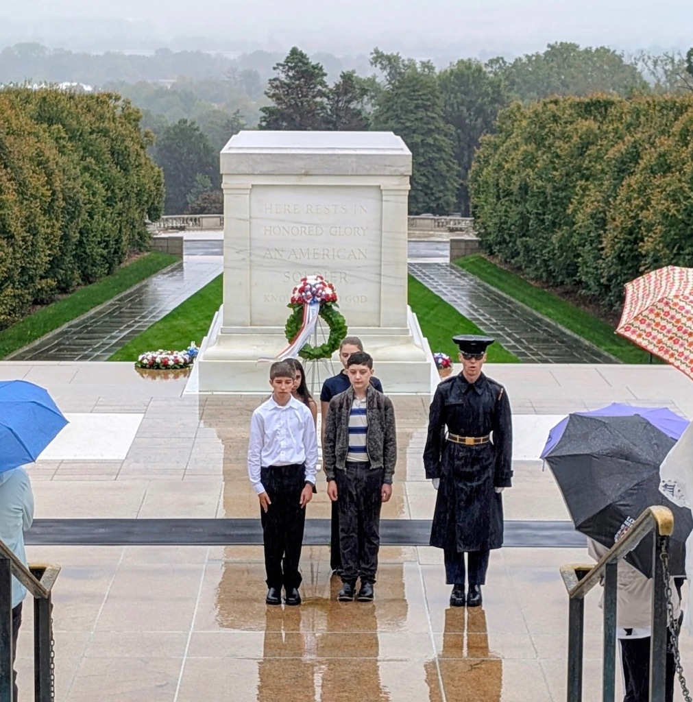 eighth grade students in DC standing in front of tomb of the unknown soldier
