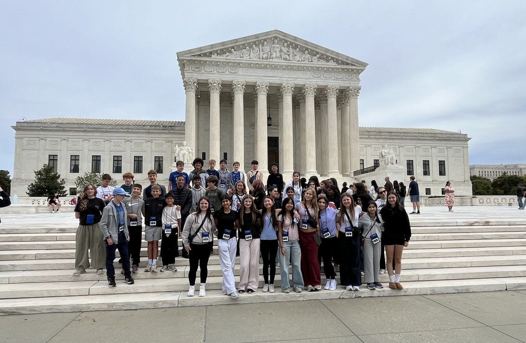 eighth grade students in DC standing in front of state capitol building