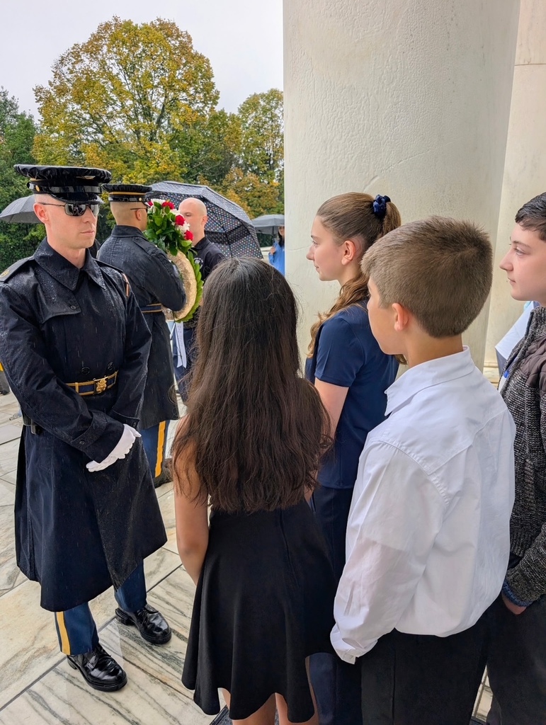eighth grade students in DC standing in front of tomb of the unknown soldier