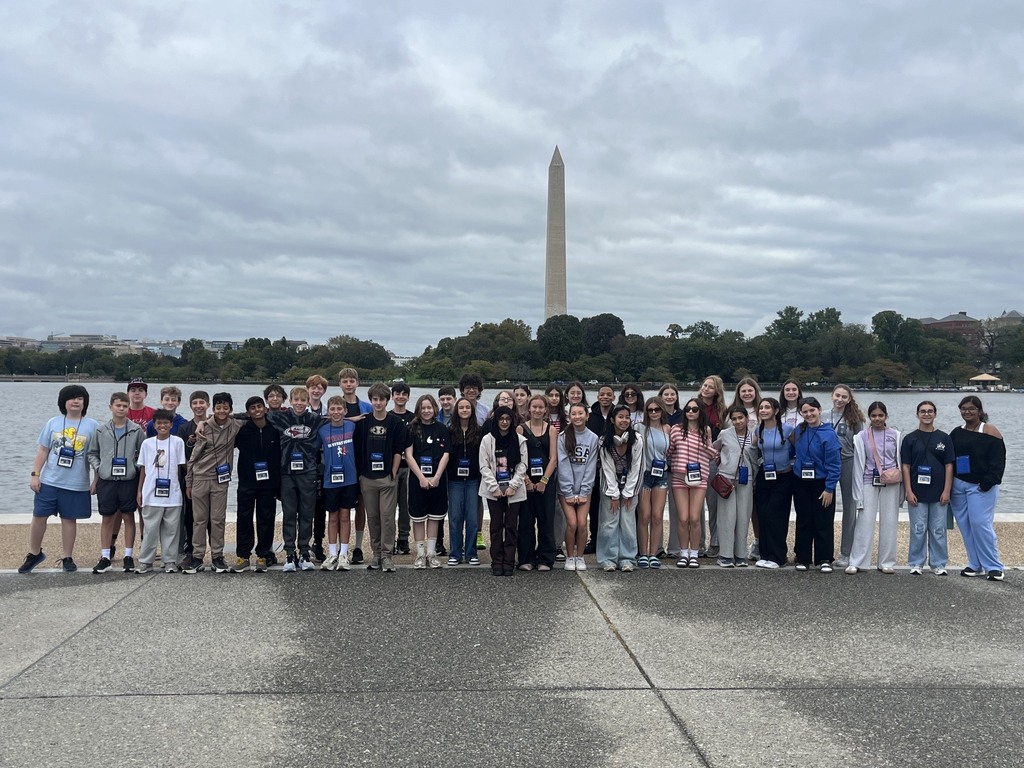 eighth grade students in DC standing in front of national monument
