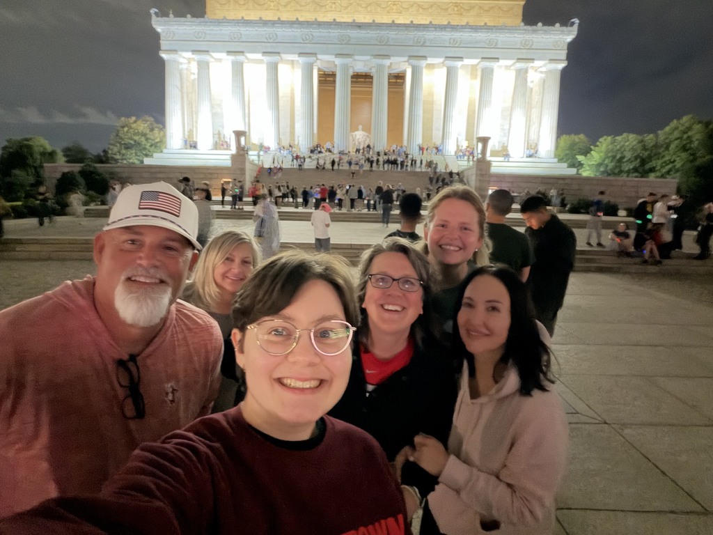 chaperones in DC standing in front of lincoln memorial