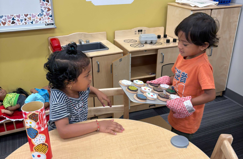 Kids playing with kitchen tools
