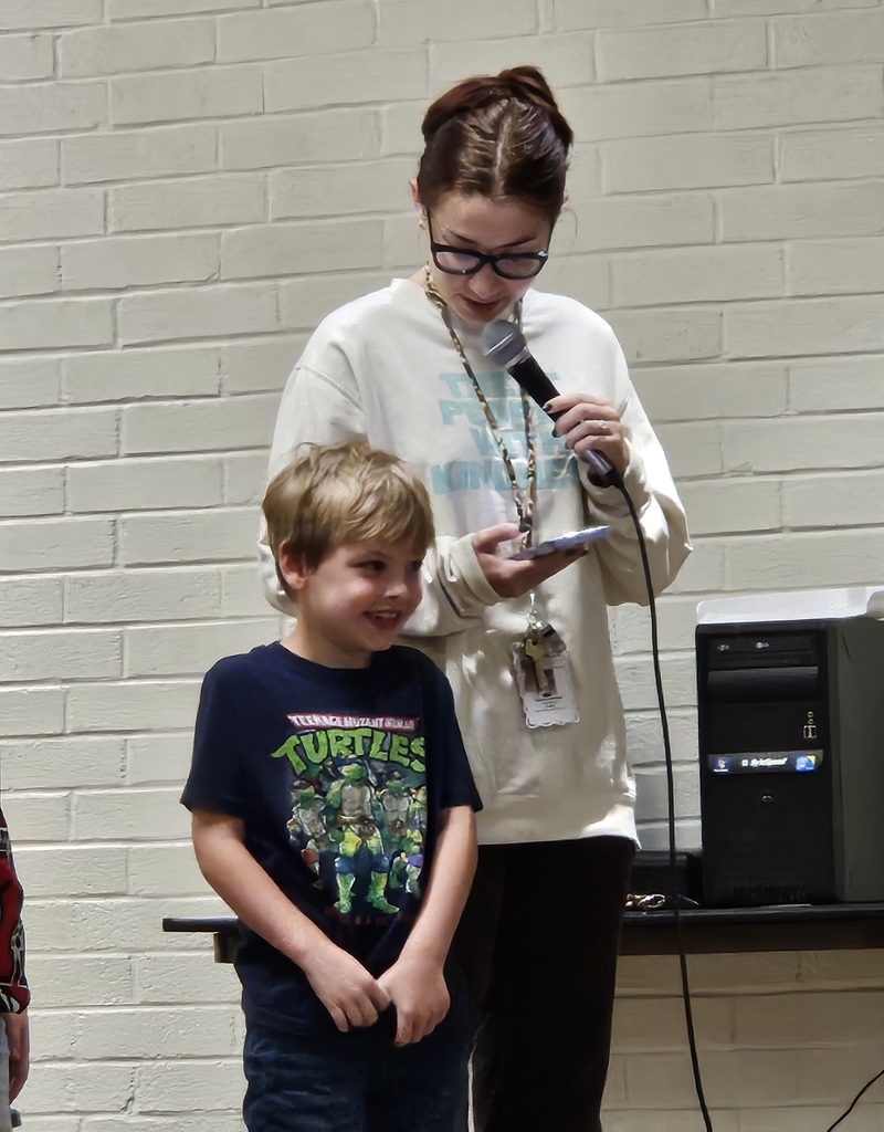 Ms. Schlinker introducing her Student of the Month, Jensen