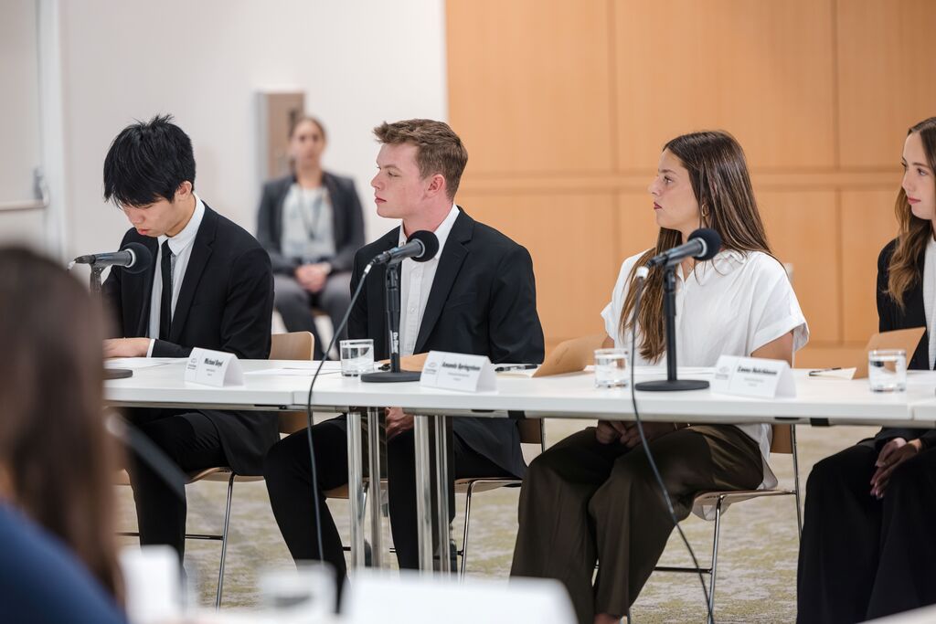 Male student participating in discussion