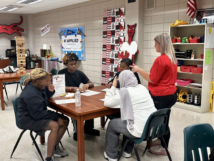 10th grade English students enjoy hands-on station activities.