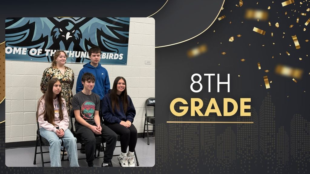 Group of 8th grade students posing in front of a Thunderbird banner, seated and standing, recognized for academic achievement.