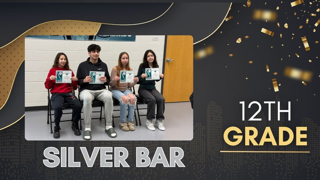 Group of 12th grade students holding certificates labeled “Silver Bar,” seated in front of a Thunderbird banner for academic awards recognition.