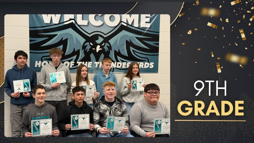 Group of 9th grade students holding award certificates, seated and standing in front of a “Home of the Thunderbirds” banner.