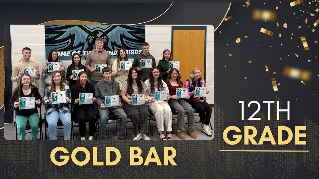 Group of 12th grade students holding certificates labeled “Gold Bar,” posing together in front of a Thunderbird banner.