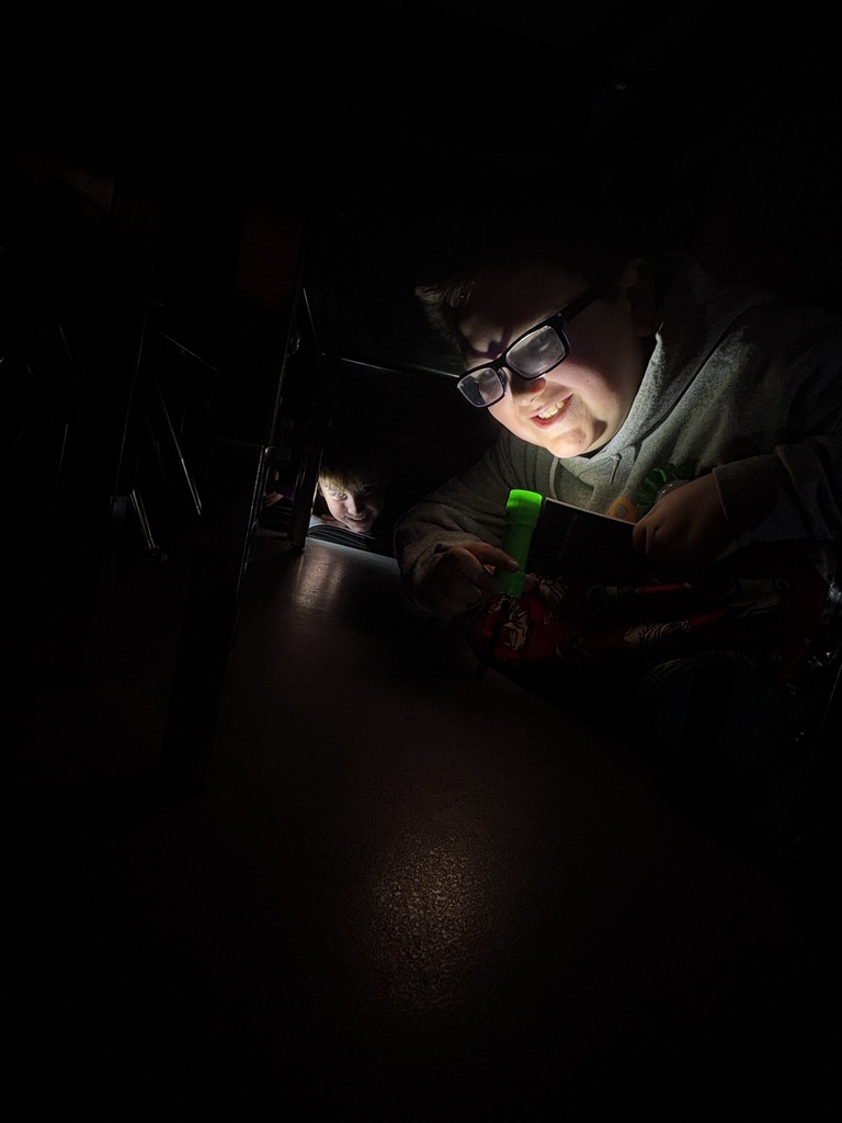 Students reading in the dark