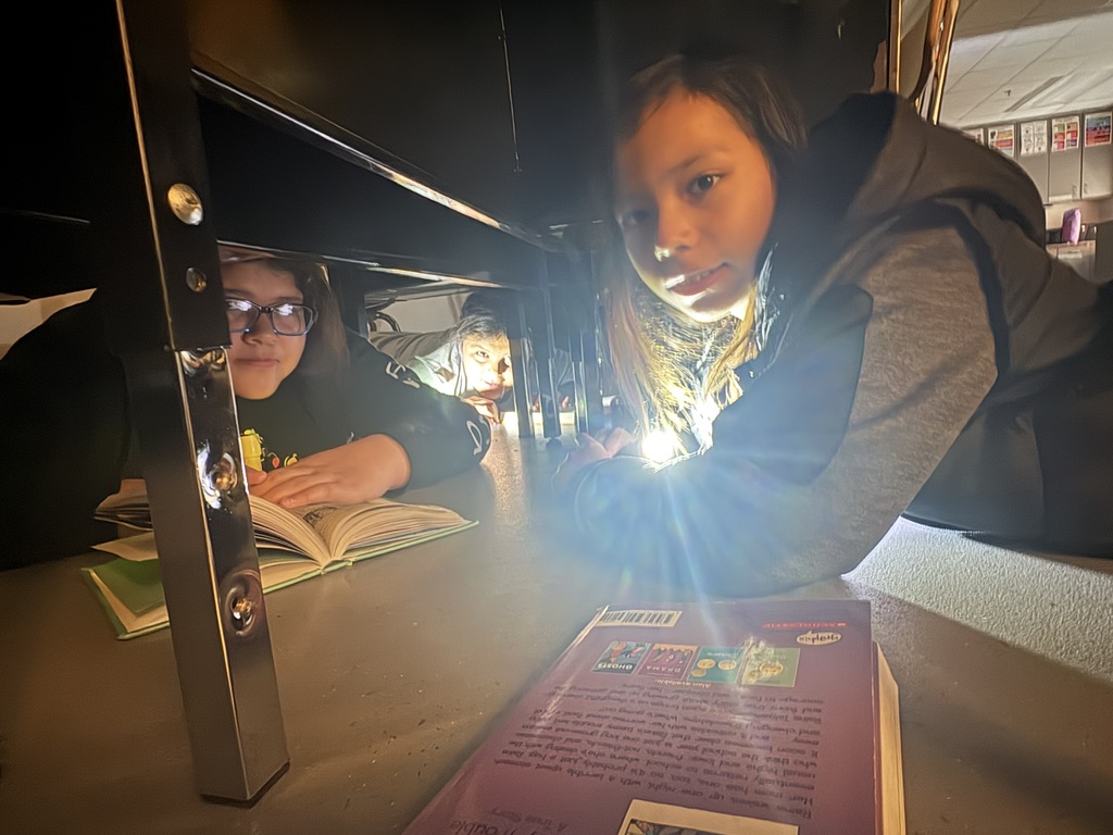 Students reading in the dark