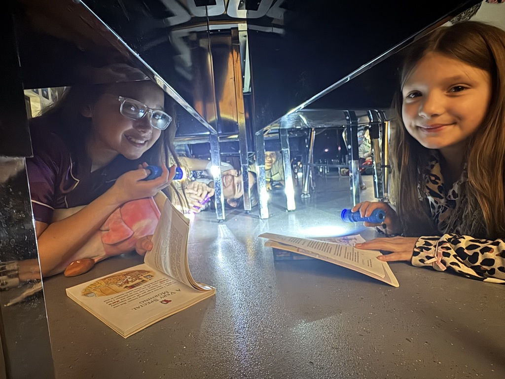 Students reading in the dark