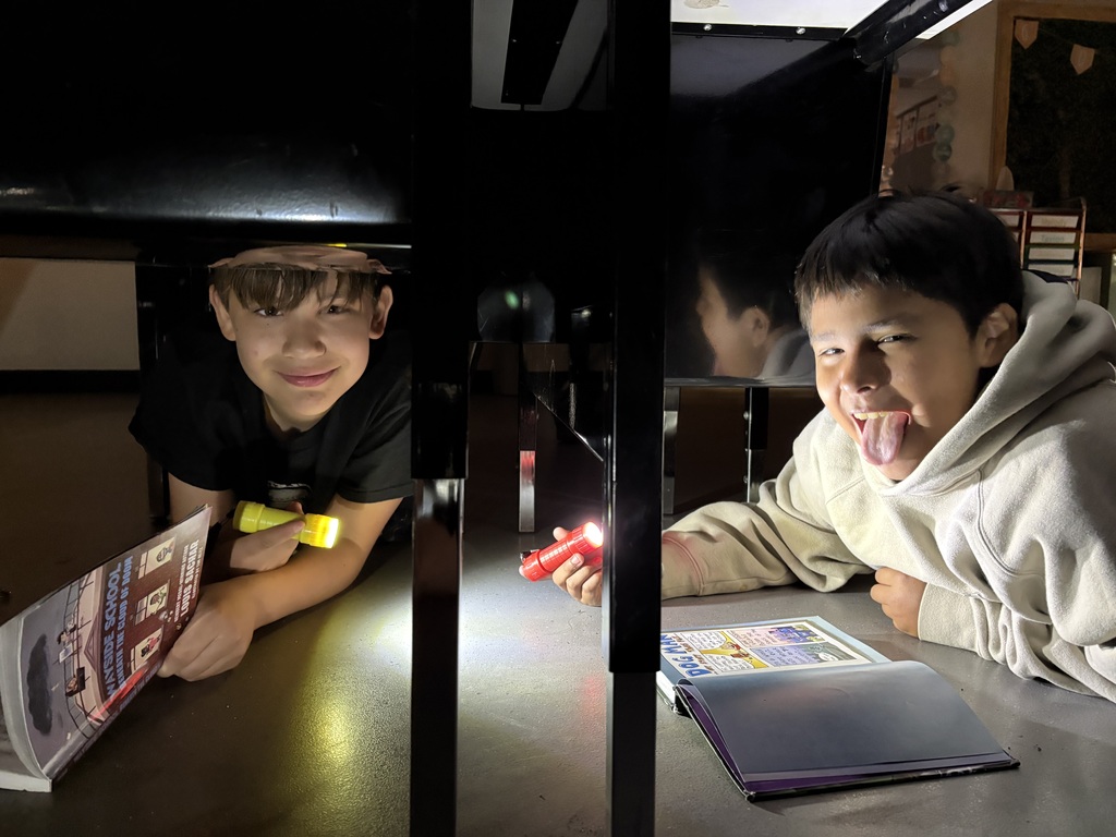 Students reading in the dark