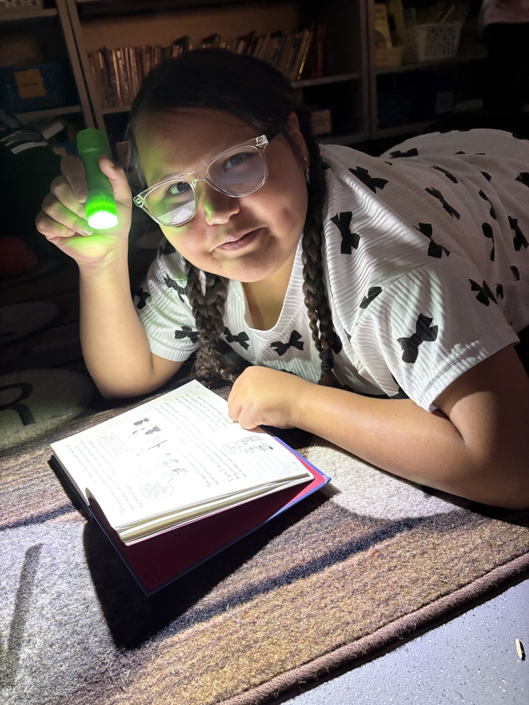 Students reading in the dark