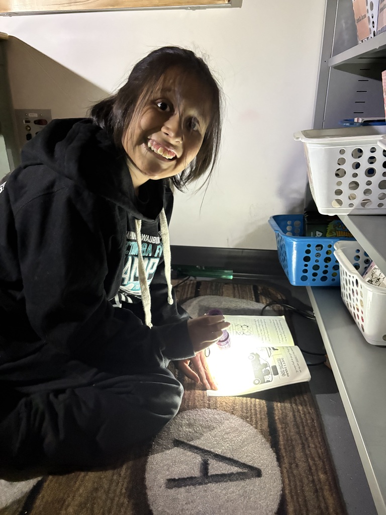 Students reading in the dark