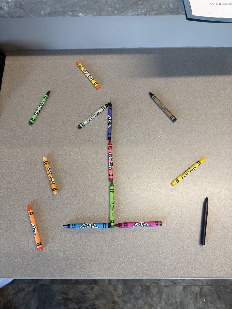 The number 1 made from crayons 